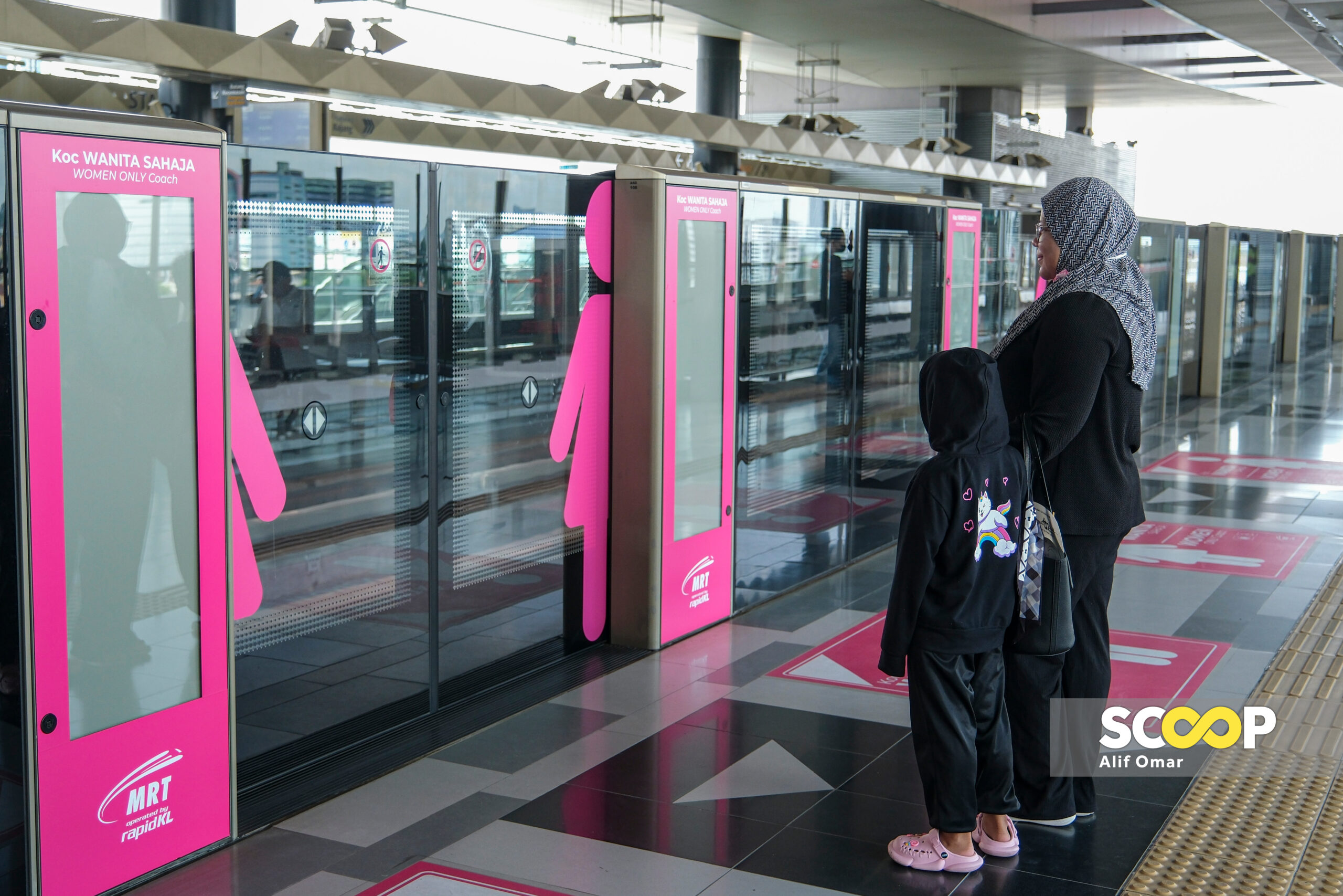 Be a gentleman, respect women’s spaces, Loke tells male MRT passengers 