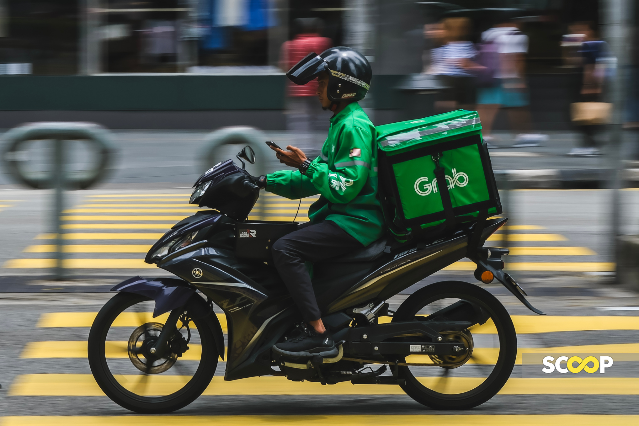 Grab riders seen benefiting from new earning structure during high ...