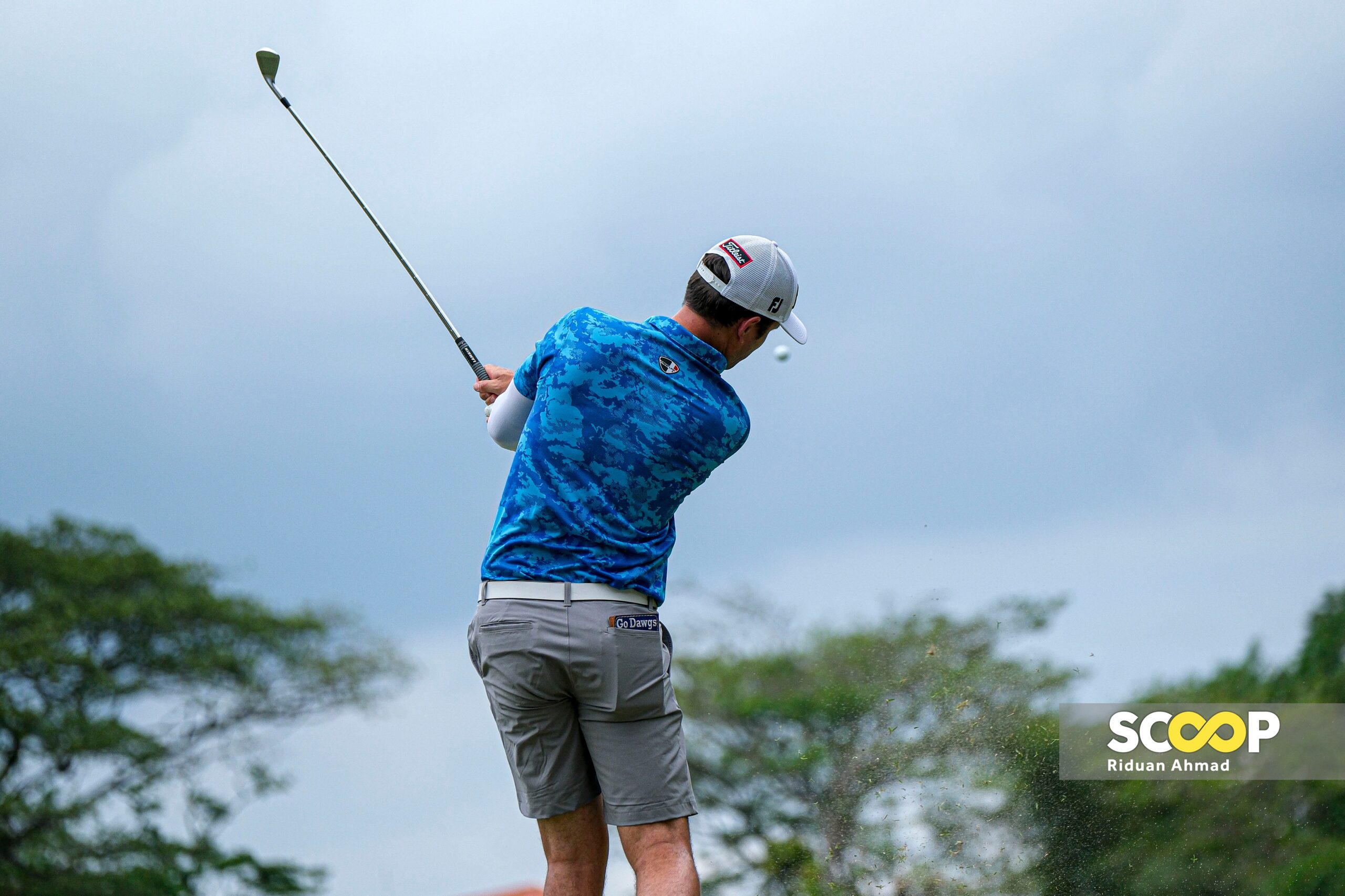 Photo of the day: Golfer Simsby swings swiftly despite early setback at Malaysian Open