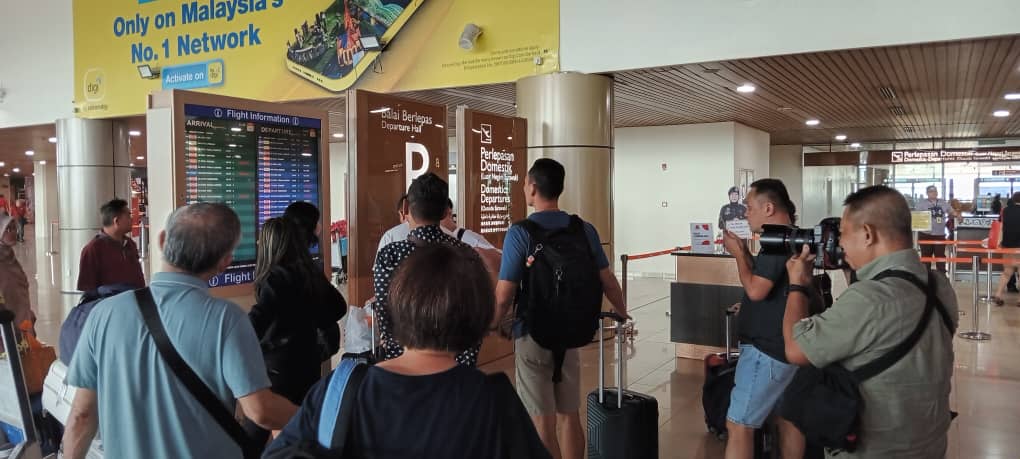 Mount Ruang eruption: passengers stuck at Kuching International Airport wait for skies to clear