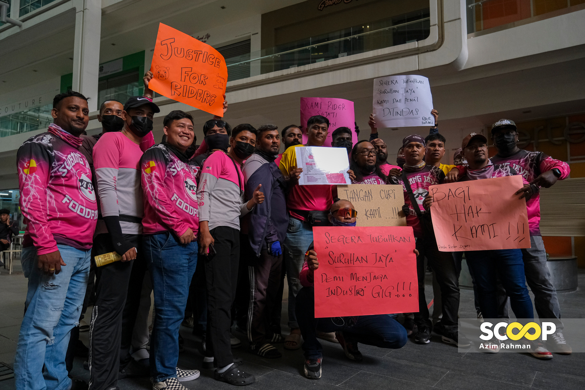 More than 100 Foodpanda riders protest over low wages at company headquarters